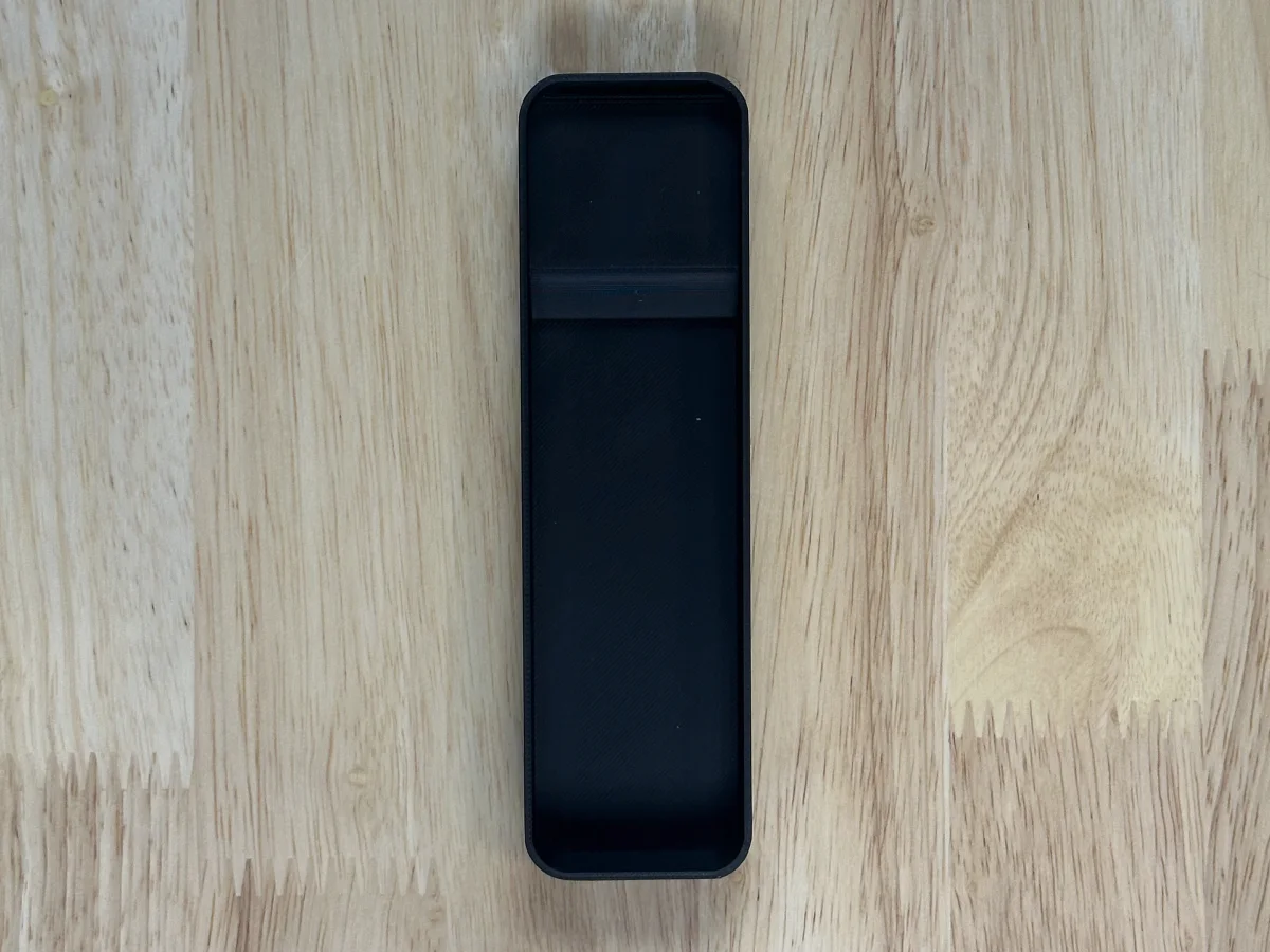 The thin ShadowFit test piece printed for a light remote, empty