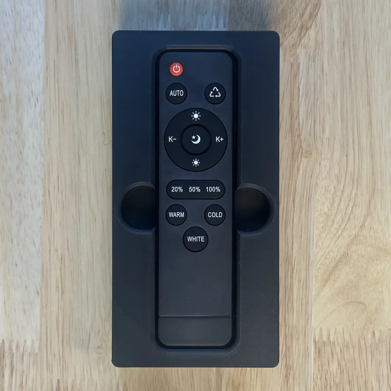 A light remote in its shadowbox